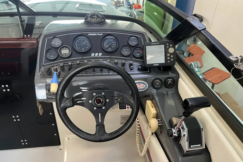 Slide: The Image of 1990 Powerplay Spectra XL engine compartment with MerCruiser V8 engine components. - 10