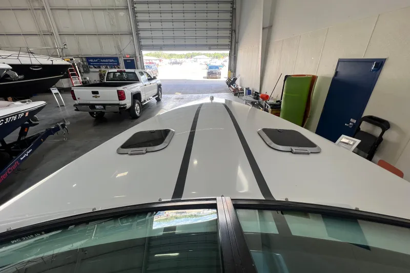 Slide: The Image of Interior of a 1990 Powerplay Spectra XL boat with steering wheel and dashboard controls. - 13