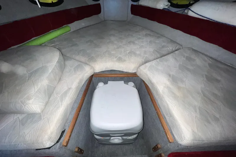 Slide: The Image of 1990 Powerplay Spectra XL boat in garage with truck and equipment. - 14