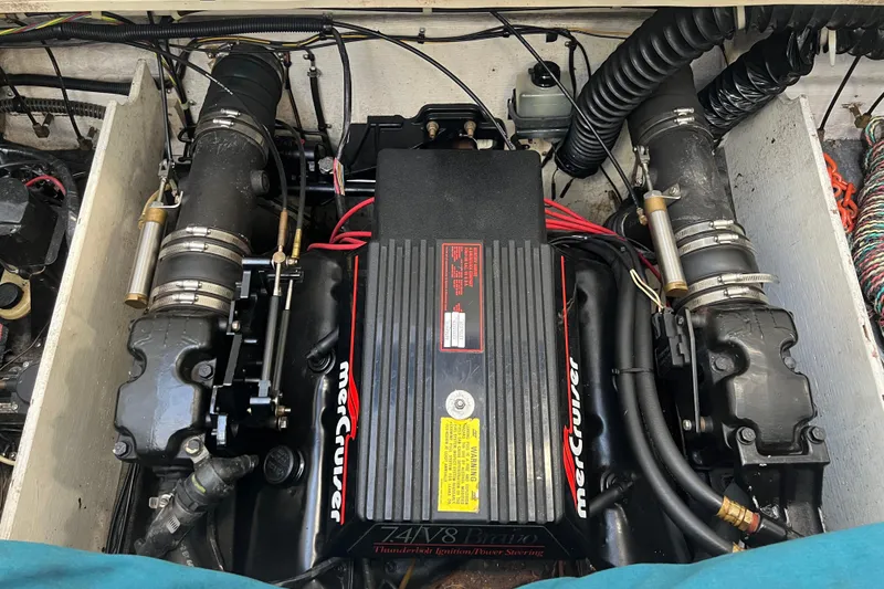 Slide: The Image of 1990 Powerplay Spectra XL boat interior with colorful striped seating in a showroom. - 9