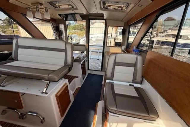 Slide: The Image of 2024 Cutwater C-30 Sedan interior with modern seating and panoramic windows. - 14