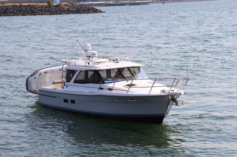 Slide: The Image of 2024 Cutwater C-30 Sedan cruising on open water, showcasing sleek design and modern features. - 6