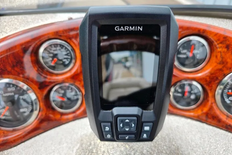 Slide: The Image of Dashboard of 2005 Triton SF18 F&S with Garmin device and analog gauges. - 19