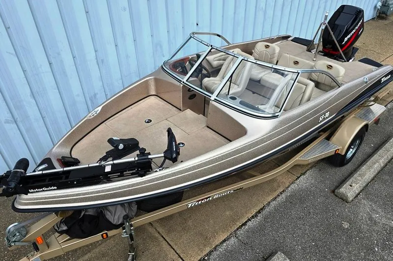 Slide: The Image of 2005 Triton SF18 F&S boat on trailer, featuring spacious seating and MotorGuide trolling motor. - 3