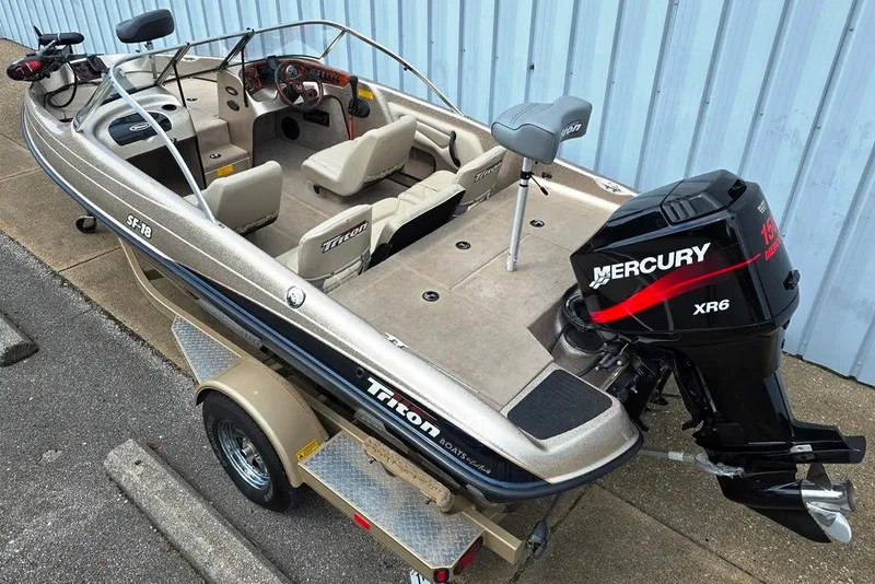 Slide: The Image of 2005 Triton SF18 F&S boat with Mercury XR6 engine on trailer. - 4