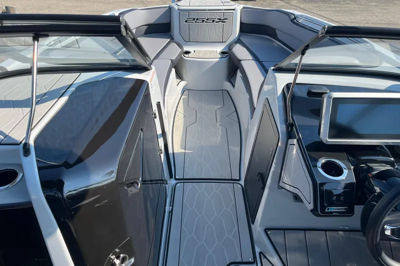Slide: The Image of 2024 Yamaha Boats 255XD interior with sleek design and modern dashboard. - 10