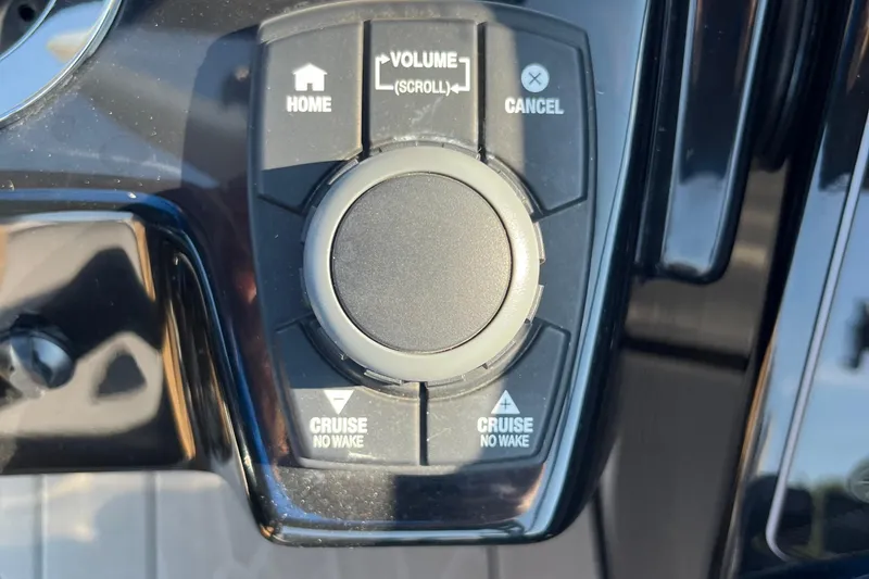 Slide: The Image of Control panel of 2024 Yamaha Boats 255XD featuring volume and cruise settings. - 12