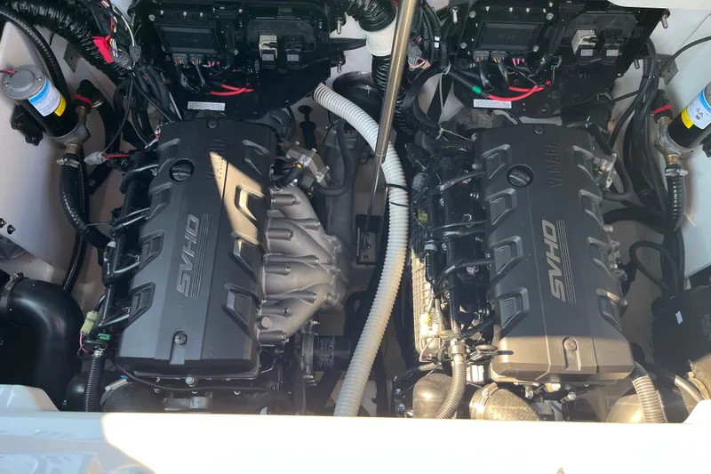Slide: The Image of 2024 Yamaha Boats 255XD engine compartment with dual SVHO engines. - 15