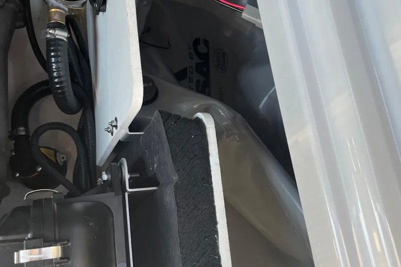 Slide: The Image of 2024 Yamaha Boats 255XD engine compartment with visible components and wiring. - 2