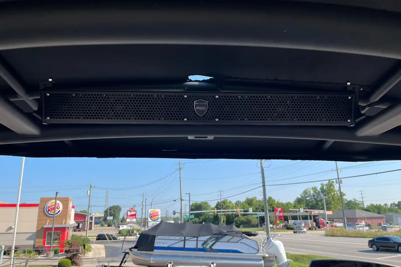 Slide: The Image of 2024 Yamaha Boats 255XD sound system, with a cityscape and Burger King in the background. - 22