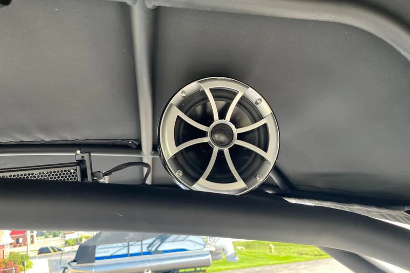 Slide: The Image of Speaker system on 2024 Yamaha Boats 255XD, mounted under the boat's canopy. - 23