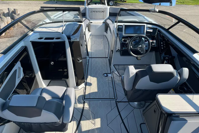 Slide: The Image of 2024 Yamaha Boats 255XD interior with modern dashboard and seating. - 5