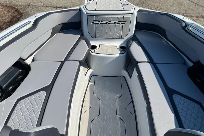 Slide: The Image of 2024 Yamaha Boats 255XD interior with gray seating and modern design. - 7