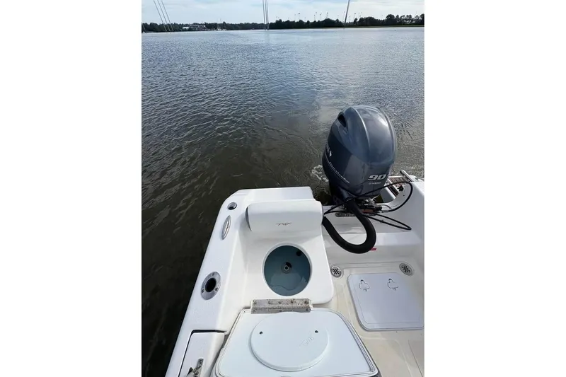 Slide: The Image of 2017 Tidewater 180 CC Adventure boat with Yamaha 90 outboard motor on calm water. - 11