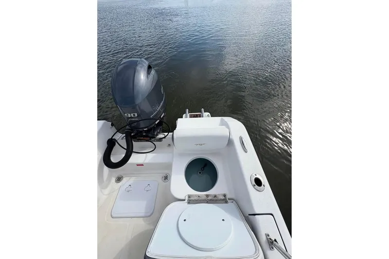 Slide: The Image of 2017 Tidewater 180 CC Adventure boat with Yamaha 90 engine on calm water. - 12