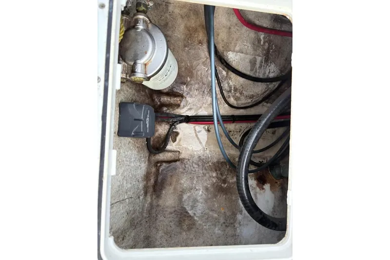 Slide: The Image of 2017 Tidewater 180 CC Adventure boat wiring and fuel filter compartment. - 17