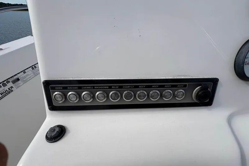 Slide: The Image of Control panel of a 2017 Tidewater 180 CC Adventure boat with labeled switches. - 18