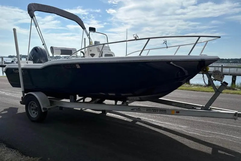 Slide: The Image of 2017 Tidewater 180 CC Adventure boat on trailer by waterfront. - 3