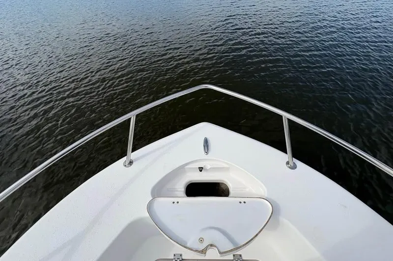 Slide: The Image of Bow view of 2017 Tidewater 180 CC Adventure boat on calm water. - 8