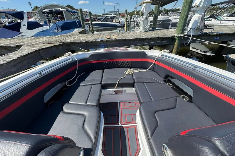 Slide: The Image of Luxurious seating area on a 2026 Monterey M65 boat docked at a marina. - 10