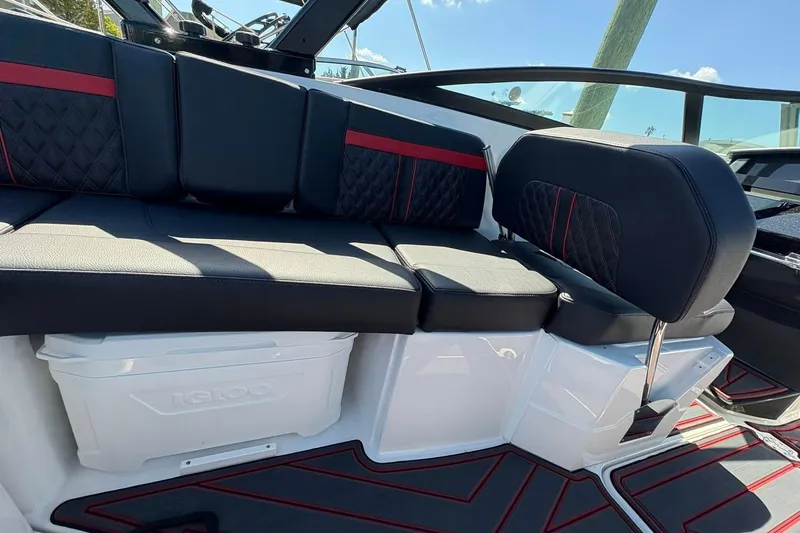 Slide: The Image of Luxurious seating on 2026 Monterey M65 boat with stylish black and red upholstery. - 14