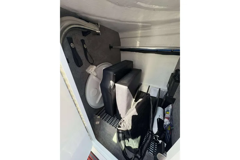 Slide: The Image of Storage compartment of 2026 Monterey M65 boat with various equipment and accessories. - 17