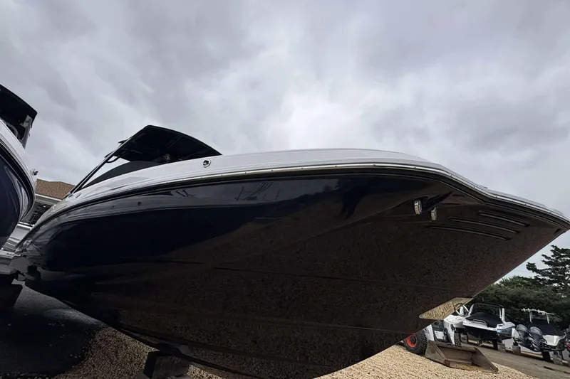 Slide: The Image of 2026 Monterey M65 boat with sleek design under cloudy sky. - 5