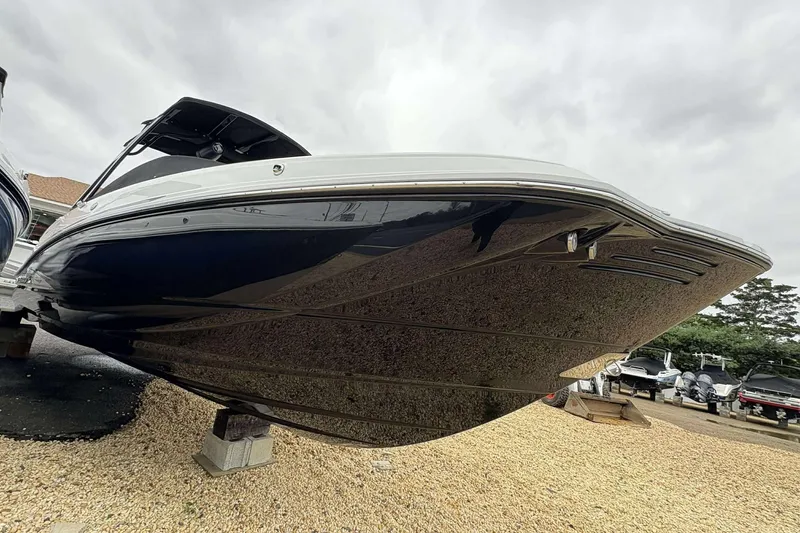 Slide: The Image of 2026 Monterey M65 boat on display, showcasing sleek hull design and modern features. - 6