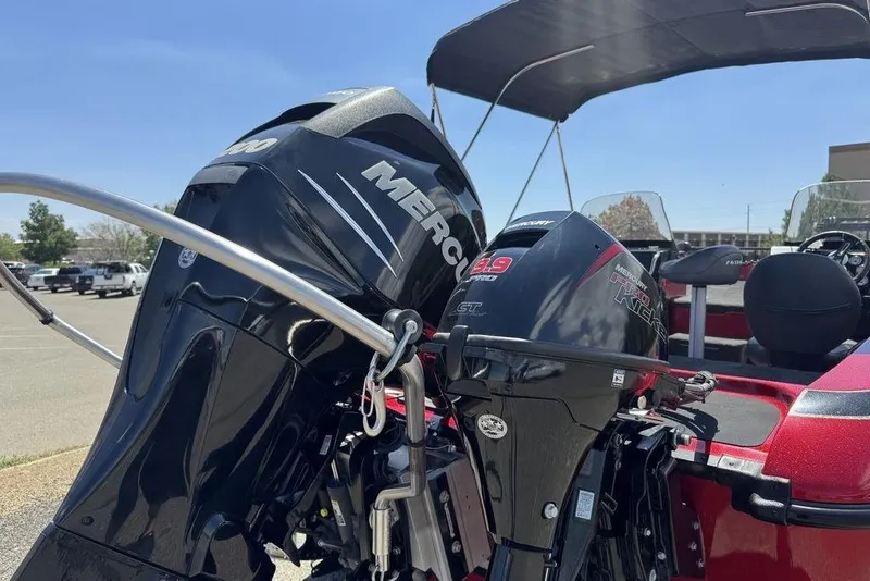 Slide: The Image of 2017 Nitro ZV18 boat with dual Mercury outboard motors in a parking lot. - 11