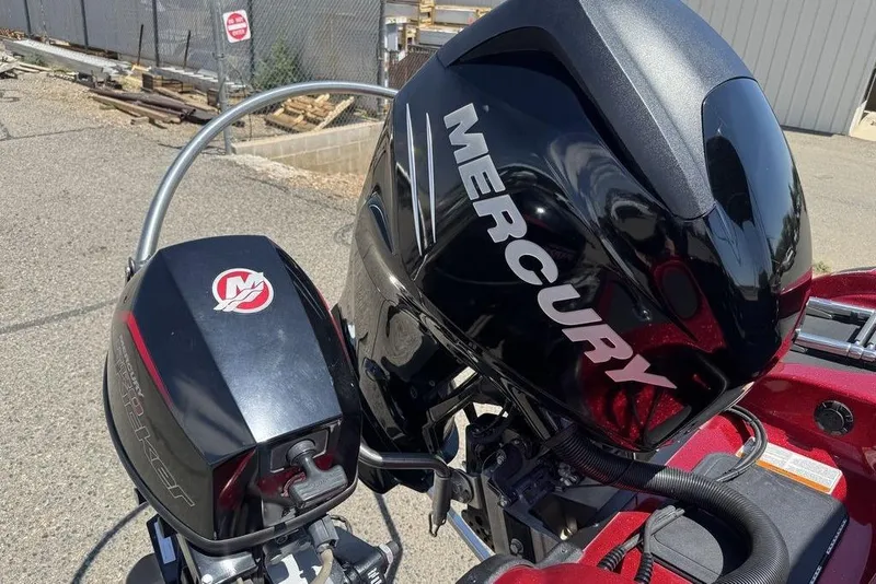 Slide: The Image of 2017 Nitro ZV18 boat with Mercury outboard motor in a sunny outdoor setting. - 19