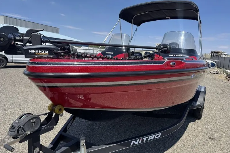 Slide: The Image of 2017 Nitro ZV18 boat with Minn Kota PowerDrive, red exterior, on a trailer. - 21