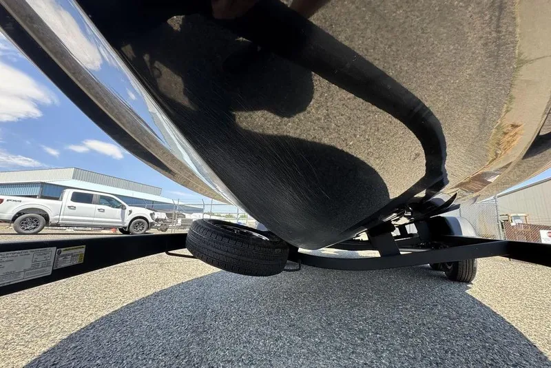 Slide: The Image of 2017 Nitro ZV18 boat underside on trailer, parked near a white truck. - 27