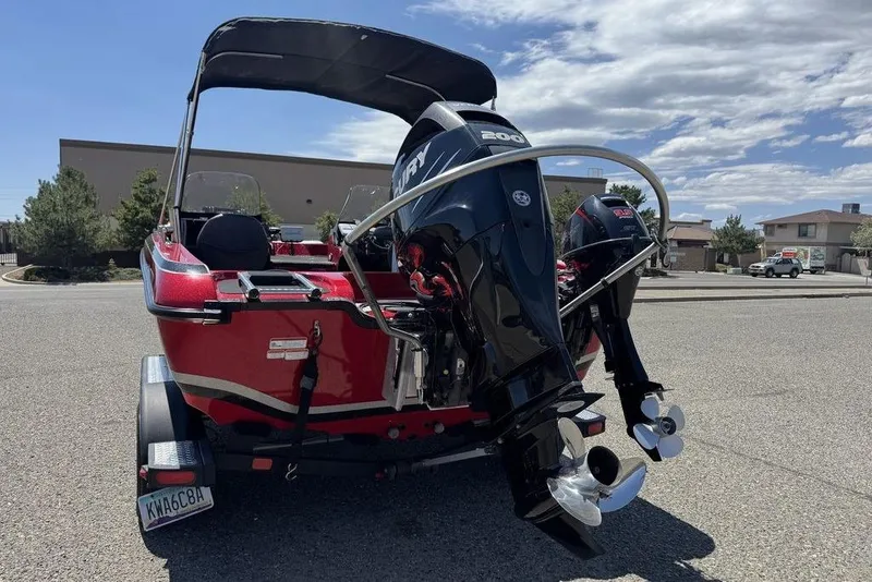 Slide: The Image of 2017 Nitro ZV18 boat with powerful outboard motor, parked on a sunny street. - 3