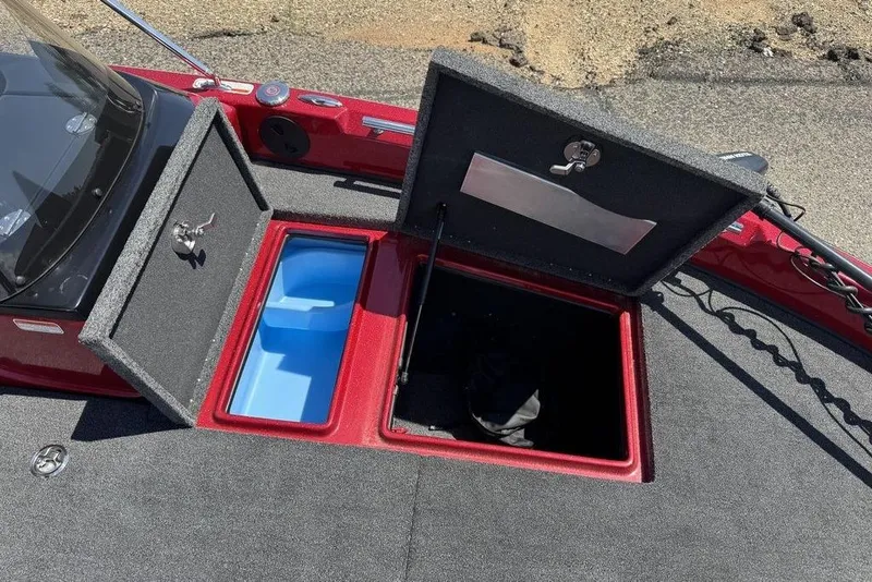 Slide: The Image of 2017 Nitro ZV18 boat storage compartments with open lids, showcasing interior space. - 30