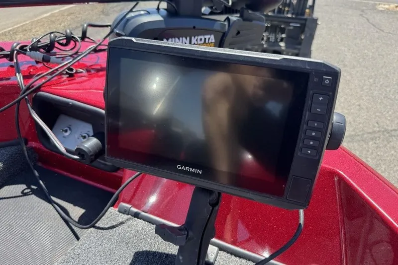 Slide: The Image of Garmin device on 2017 Nitro ZV18 boat with Minn Kota motor, red interior. - 33