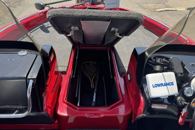 Slide: The Image of 2017 Nitro ZV18 boat interior with open storage compartment and Lowrance equipment. - 37