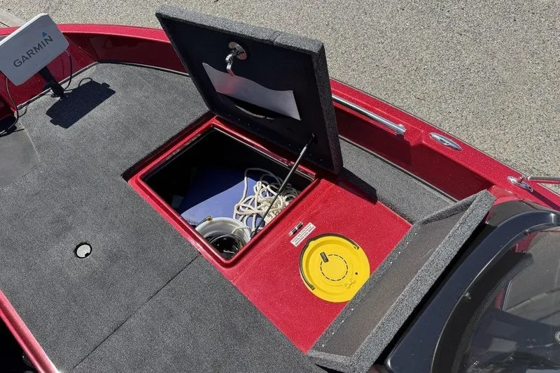 Slide: The Image of 2017 Nitro ZV18 boat deck with open storage compartment and Garmin device. - 39