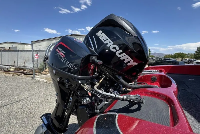 Slide: The Image of 2017 Nitro ZV18 boat with Mercury Pro Kicker outboard motor in a sunny outdoor setting. - 40