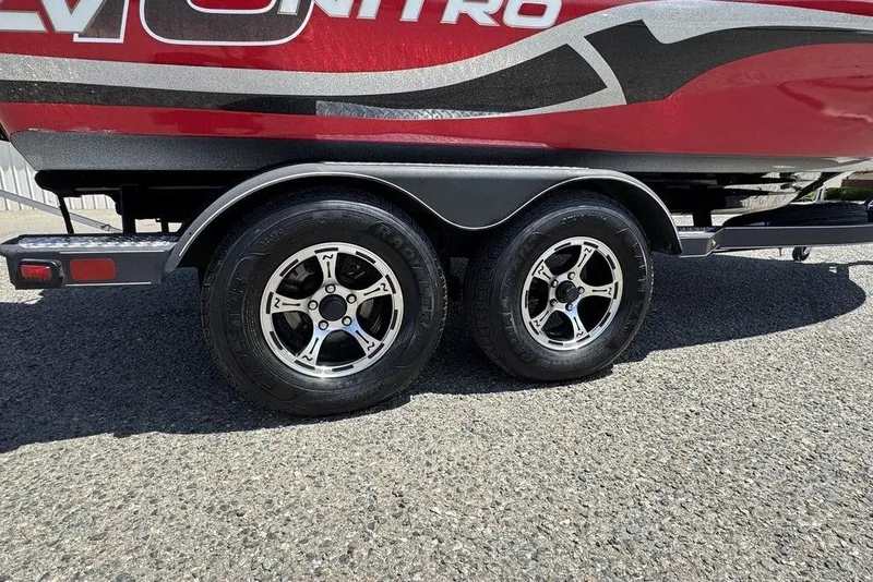 Slide: The Image of 2017 Nitro ZV18 boat trailer with dual wheels on asphalt surface. - 42