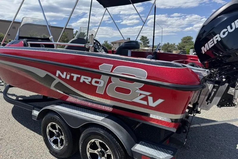Slide: The Image of Red 2017 Nitro ZV18 boat with Mercury engine on a trailer. - 5