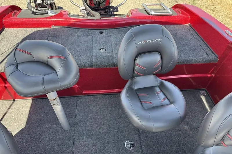 Slide: The Image of 2017 Nitro ZV18 boat interior with gray seats and red accents. - 51