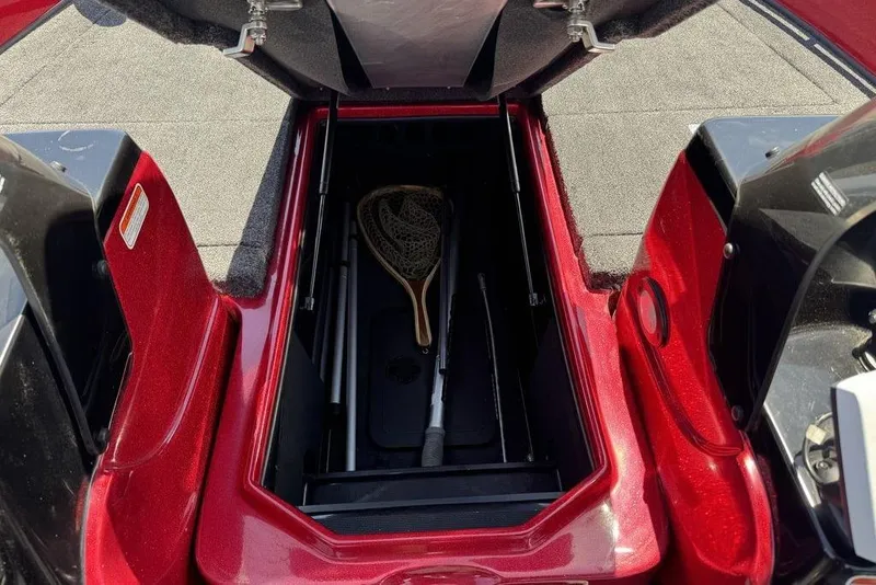 Slide: The Image of Open storage compartment of 2017 Nitro ZV18 boat with fishing gear inside. - 52