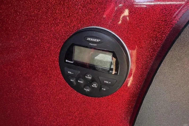 Slide: The Image of Close-up of Jensen audio system on 2017 Nitro ZV18 boat, red metallic finish. - 54