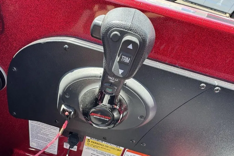 Slide: The Image of Throttle control lever on a 2017 Nitro ZV18 boat dashboard. - 55
