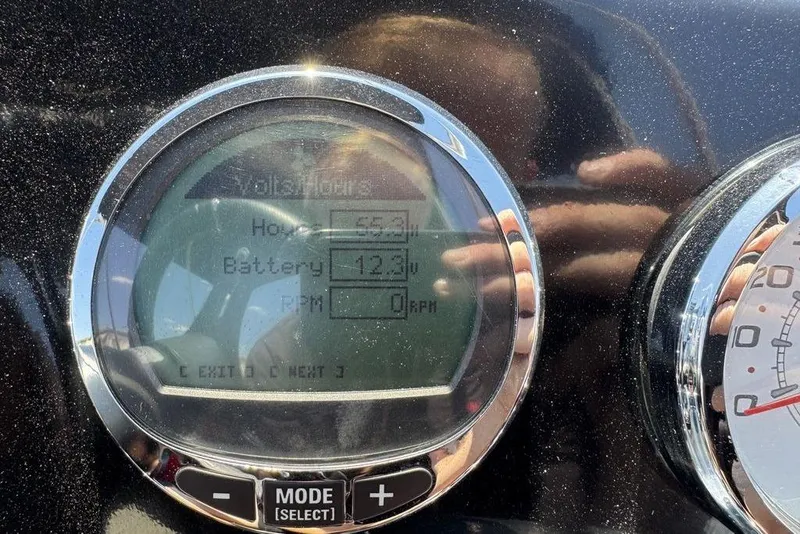 Slide: The Image of Close-up of a 2017 Nitro ZV18 dashboard display showing battery voltage and RPM. - 59