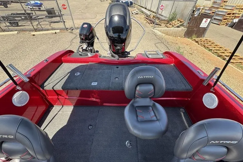 Slide: The Image of 2017 Nitro ZV18 boat interior with red accents and dual seats. - 62