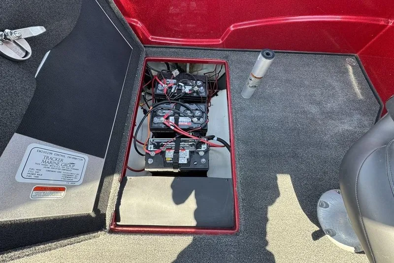 Slide: The Image of 2017 Nitro ZV18 boat battery compartment with wiring and emission control information. - 69