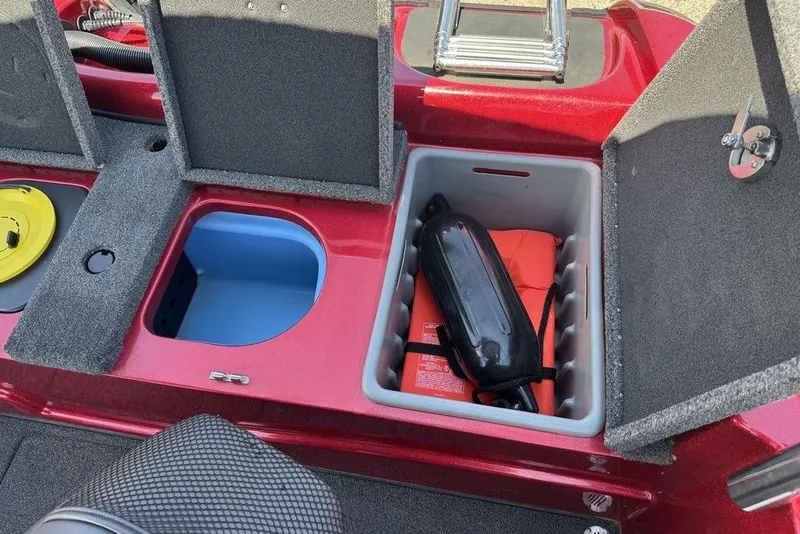 Slide: The Image of 2017 Nitro ZV18 boat storage compartments with safety equipment and accessories. - 70