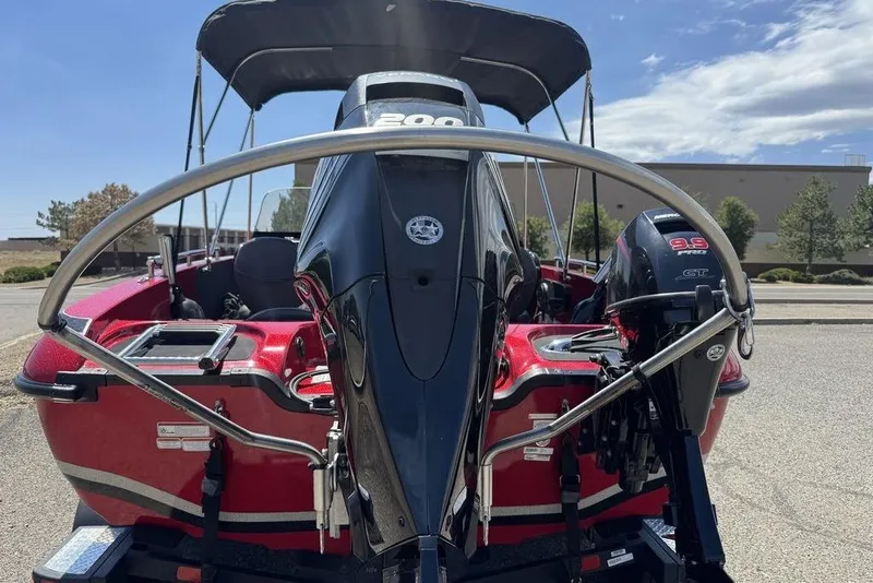 Slide: The Image of 2017 Nitro ZV18 boat with dual outboard motors, parked outdoors under a clear sky. - 9