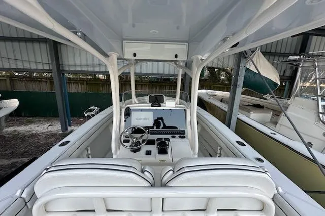 Slide: The Image of 2015 Jupiter 30 CC boat interior with steering console and seating. - 10